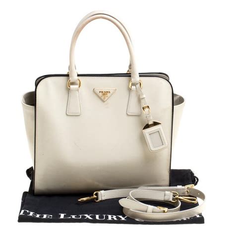 creme prada fold over latch purse|Prada purses for sale.